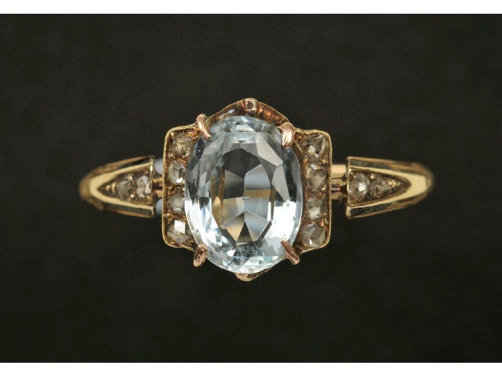 Appraisal: An Aquamarine and Diamond Ring claw-set central oval-cut stone between