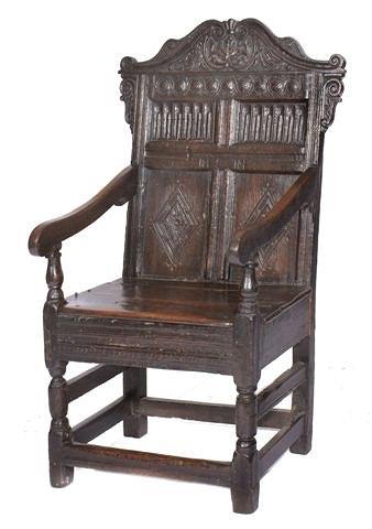 Appraisal: A TH CENTURY OAK WAINSCOT ELBOW CHAIR the back carved