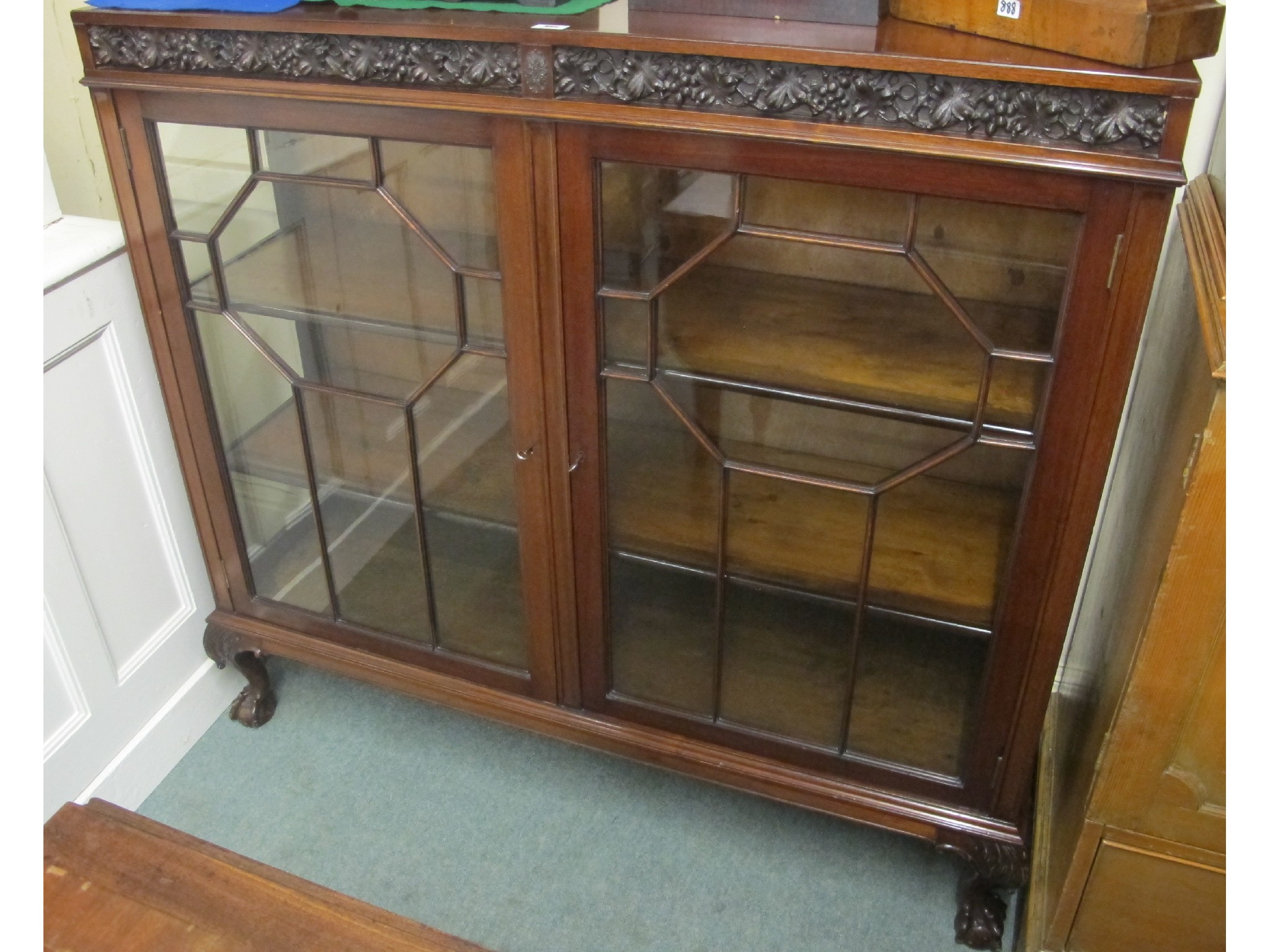 Appraisal: Mahogany two door glazed display cabinet on ball and claw