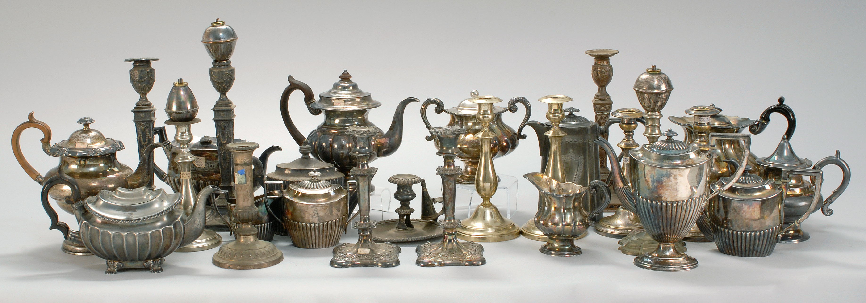 Appraisal: APPROXIMATELY THIRTY SILVER PLATED ITEMS Includes a pair of candlesticks