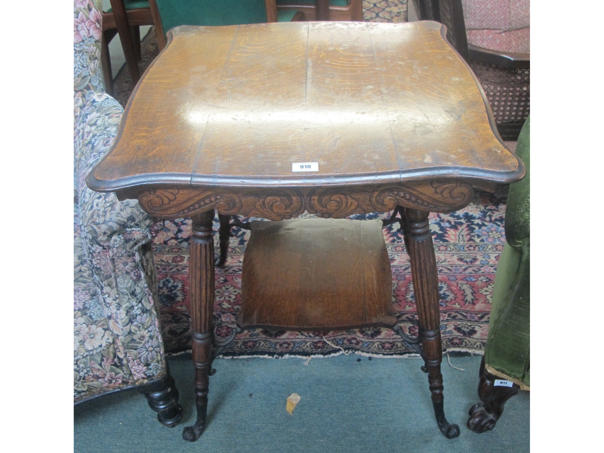 Appraisal: A Victorian oak two tier occasional table