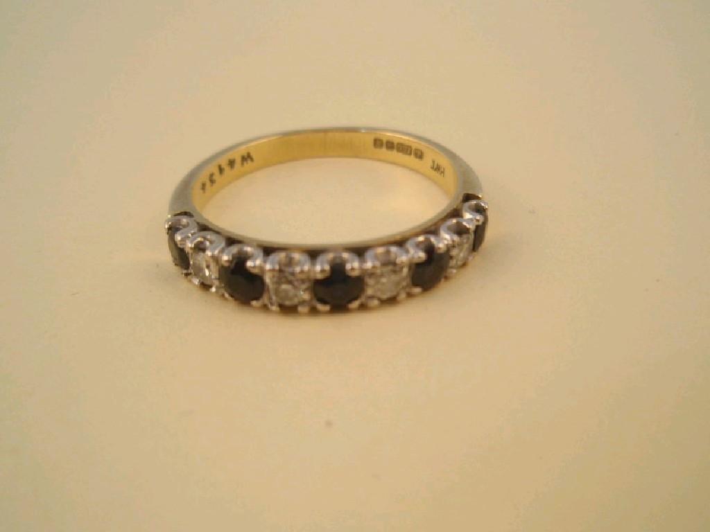 Appraisal: A half hoop eternity ring set alternately with five sapphires