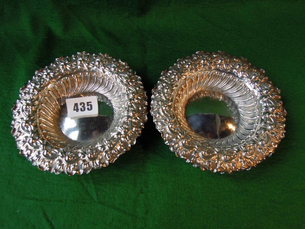 Appraisal: A pair of silver sweet meat dishes with embossed foliate