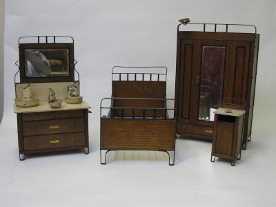 Appraisal: A suite of oak and wrought iron dolls furniture comprising