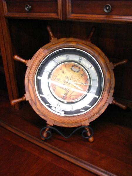 Appraisal: Small World Rhythm Ship's Wheel Clock