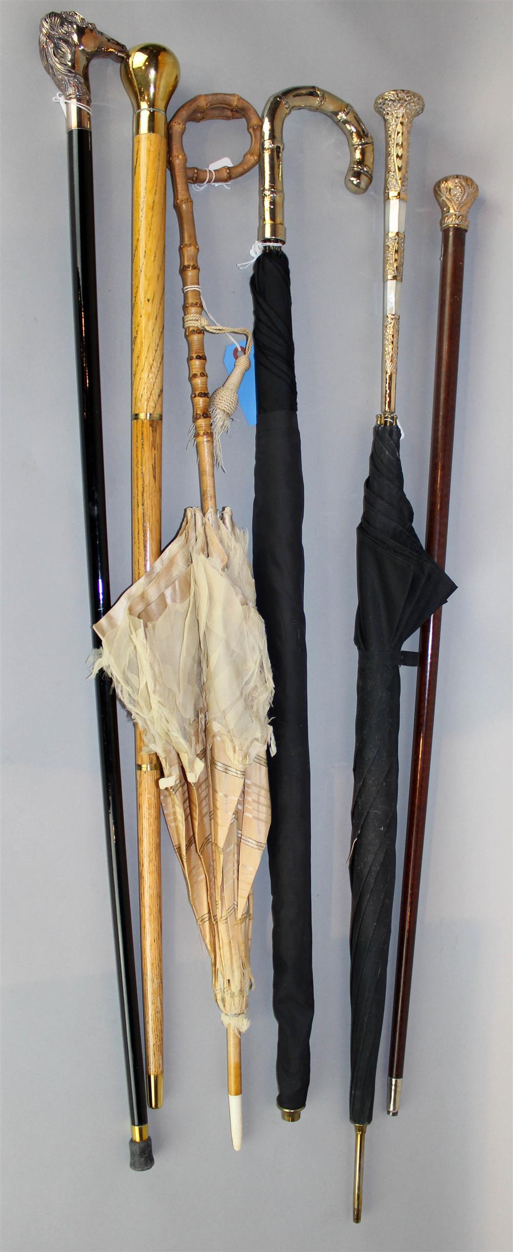 Appraisal: GROUP OF WALKING STICKS UMBRELLAS AND A PARASOL including two