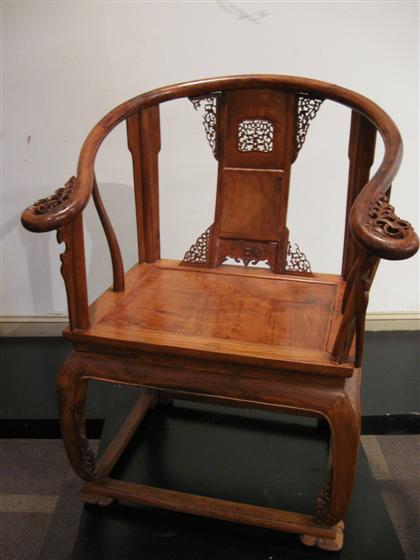 Appraisal: Chinese huanghuali and mixed wood horseshoe chairPaneled and rounded horseshoe