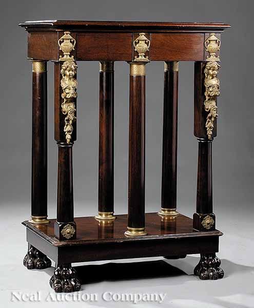 Appraisal: An Empire-Style Mahogany and Bronze-Mounted Console Table molded top urn