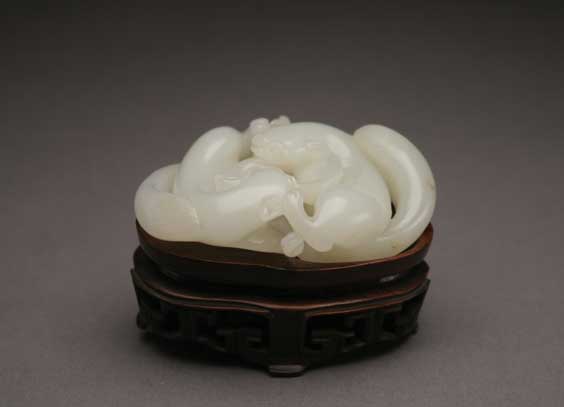 Appraisal: QIANLONG WHITE JADE TOGGLE Very finely carved and polished antique