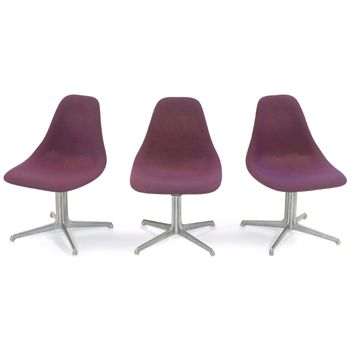 Appraisal: Charles Eames style chairs three maker unknown LaFonda style aluminum