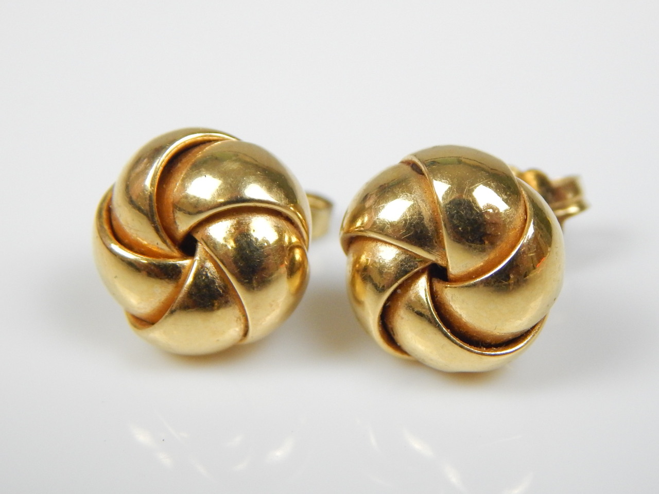 Appraisal: A pair of ct gold knot earrings g