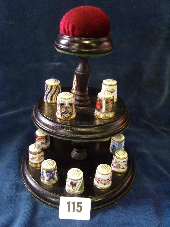 Appraisal: A -tier display stand containing a collection of Royal Crown