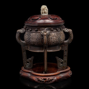 Appraisal: A Chinese Cast Bronze Incense Burner the rounded body rising