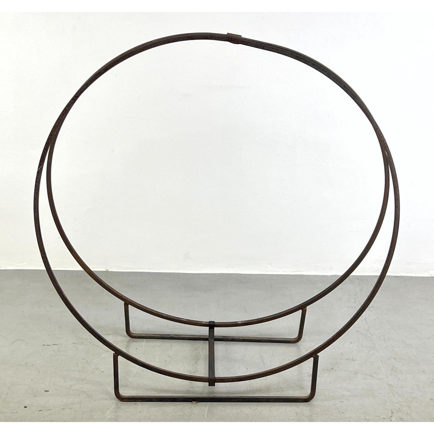 Appraisal: Modernist iron ring log holder Dimensions H inches W inches