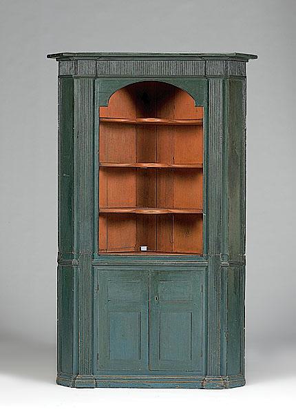 Appraisal: BLUE-PAINTED CORNER CUPBOARD American th century in pine in an