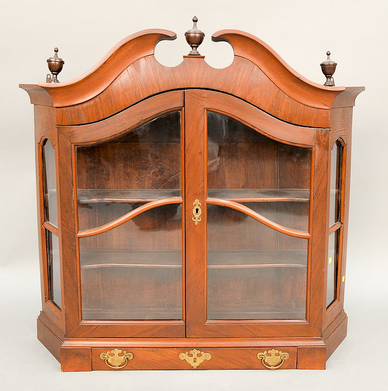 Appraisal: Mahogany hanging cupboard with broken arch top having two glazed