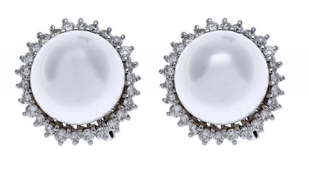 Appraisal: A PAIR OF CULTURED PEARL AND DIAMOND CLUSTER EARRINGS each