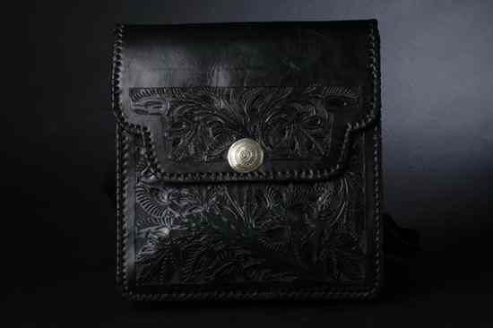 Appraisal: MEXICAN EMBOSSED BLACK LEATHER SHOULDER BAG In a saddlebag style