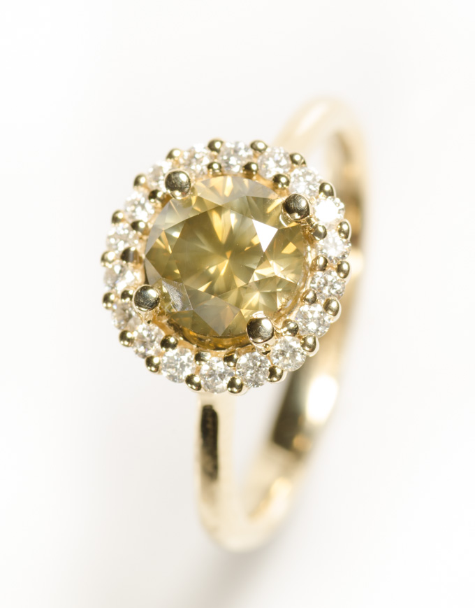 Appraisal: FANCY COLORED DIAMOND AND FOURTEEN KARAT GOLD RING with round-cut