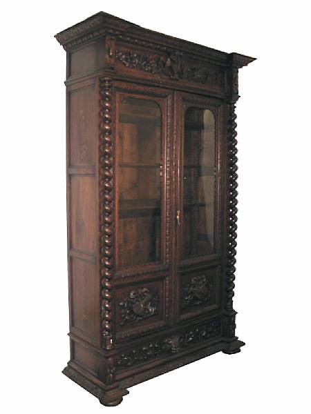 Appraisal: A Renaissance style carved oak bookcase second half th century