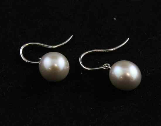 Appraisal: A pair of George Praquell white gold mounted cultured pearl