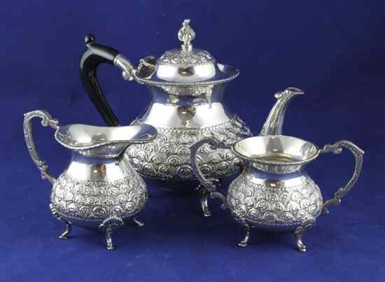 Appraisal: An Indian white metal three piece tea set of baluster