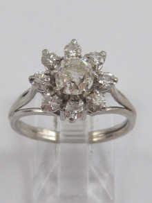 Appraisal: A French hallmarked platinum and carat white gold diamond cluster