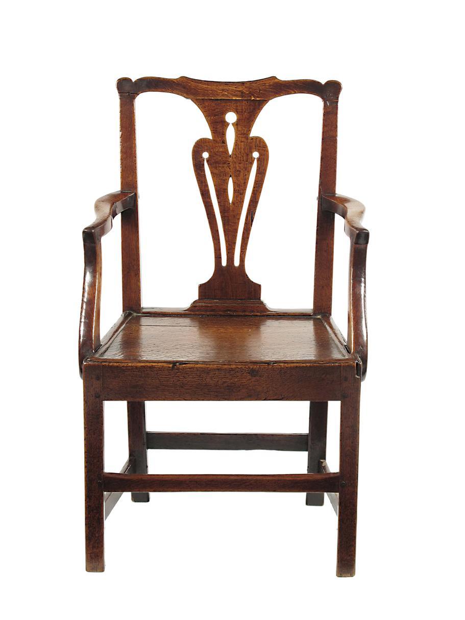 Appraisal: A George III oak open armchair