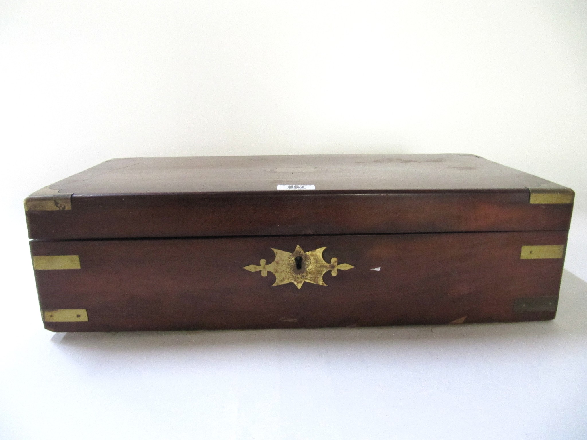 Appraisal: A Victorian mahogany brass-bound writing slope with ink wells