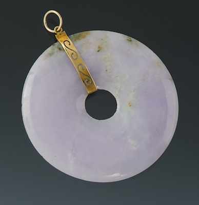 Appraisal: A Chinese Carved Jadeite Disk Pendant Carved jadeite disk of