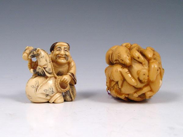 Appraisal: CARVED SIGNED IVORY NETSUKES Two piece MAN WITH RAT rat