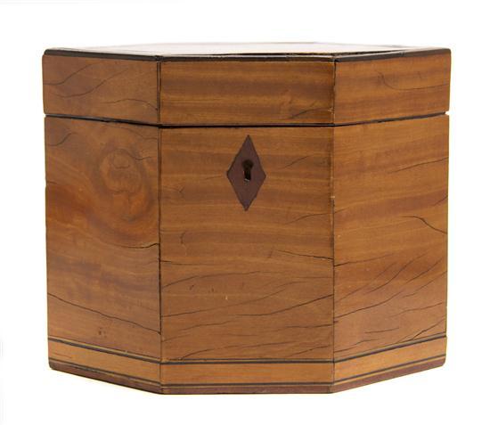 Appraisal: An English Fruitwood Tea Caddy of elongated hexagonal form having