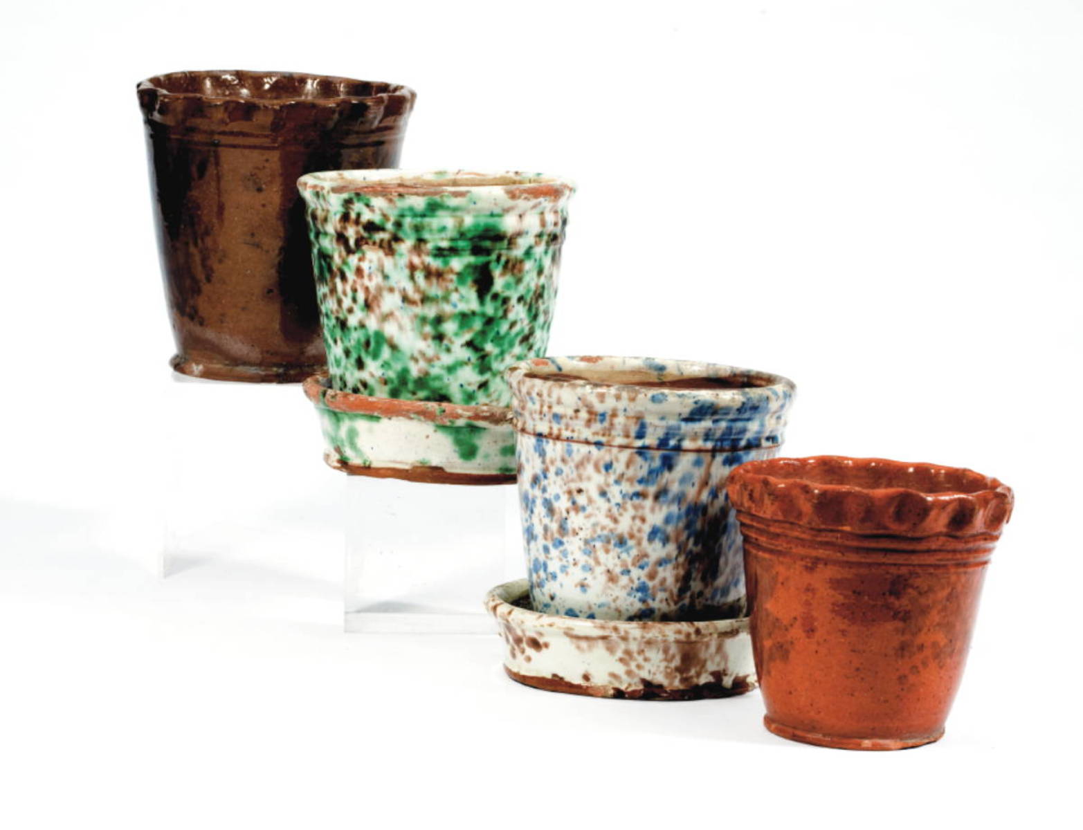 Appraisal: TWO GLAZED REDWARE FLOWER POTS NINETEENTH CENTURY Surrounded by incised