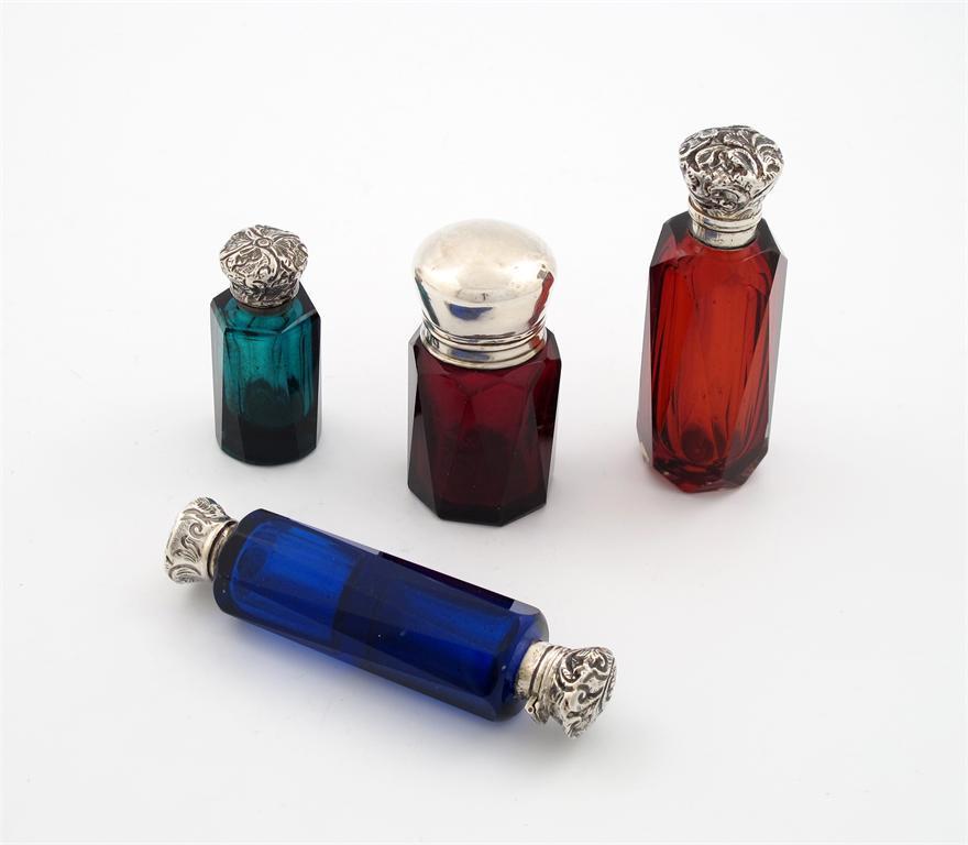 Appraisal: A small collection of four Victorian silver mounted scent bottles