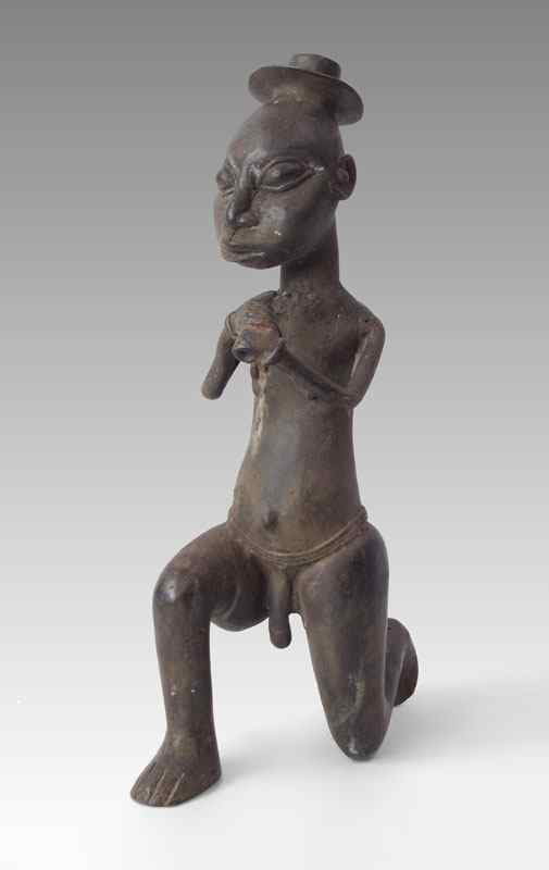 Appraisal: SMALL AFRICAN BRONZE FIGURE OF A KNEELING MAN SCULPTURE Unusual