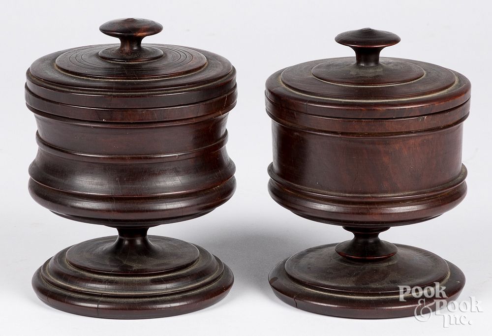 Appraisal: Two lignum vitae turned lidded canisters th c Two lignum