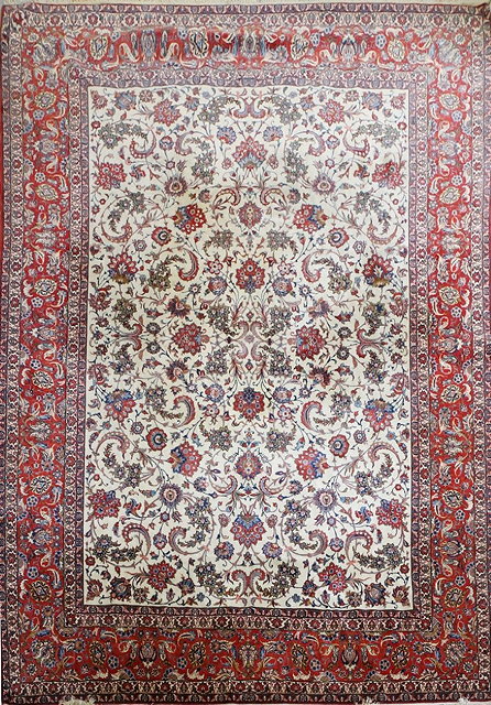 Appraisal: AN ISFAHAN WHITE GROUND FORMAL CARPET decorated with trailing foliage