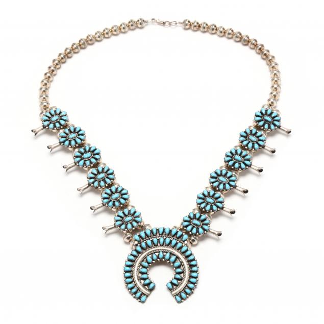 Appraisal: SILVER AND TURQUOISE SQUASH BLOSSOM NECKLACE With central naja set