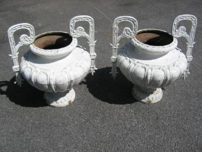 Appraisal: A PAIR OF VICTORIAN CAST IRON GARDEN URNS of lobed