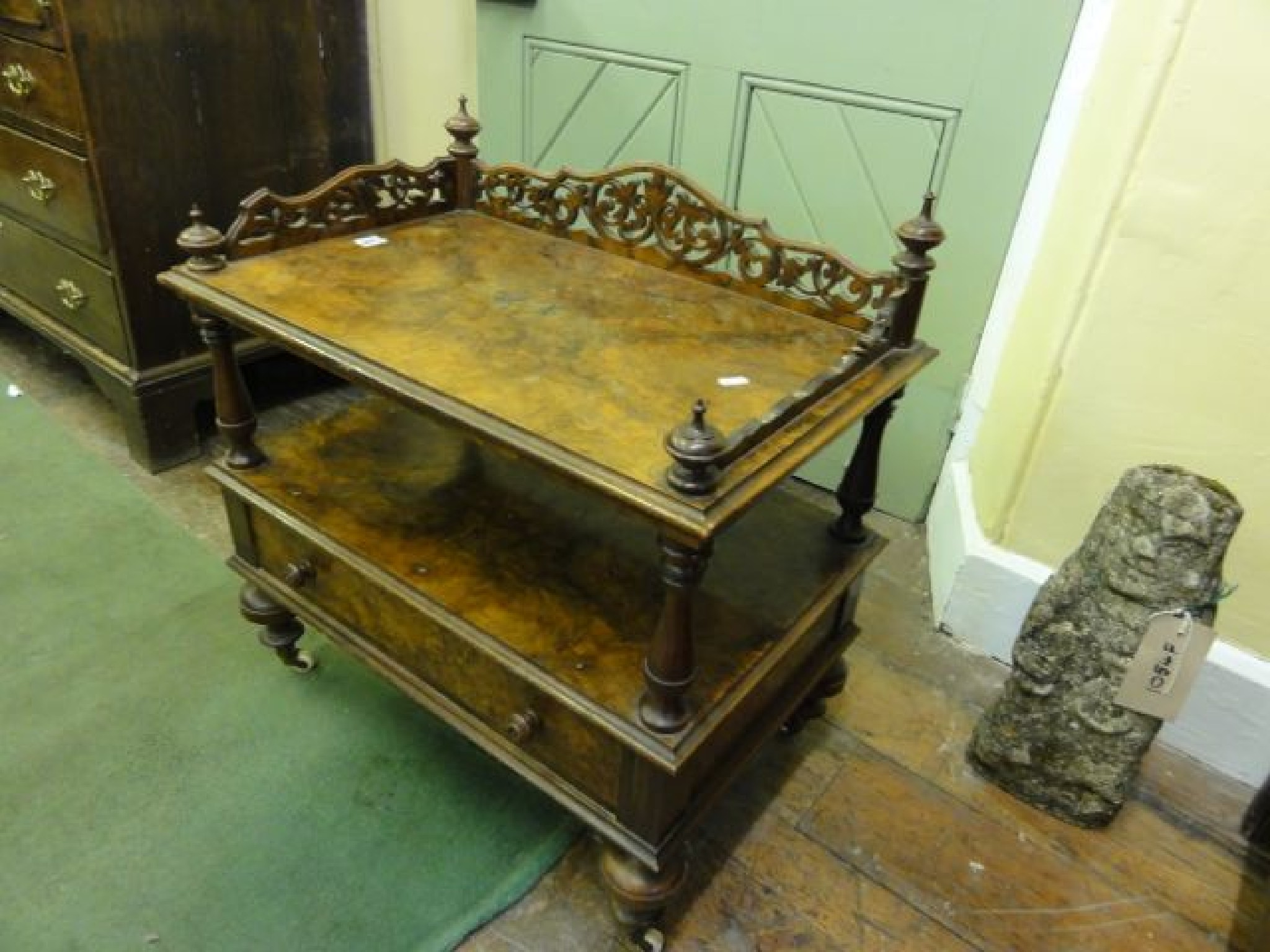 Appraisal: A Victorian burr walnut two tier side table fitted with