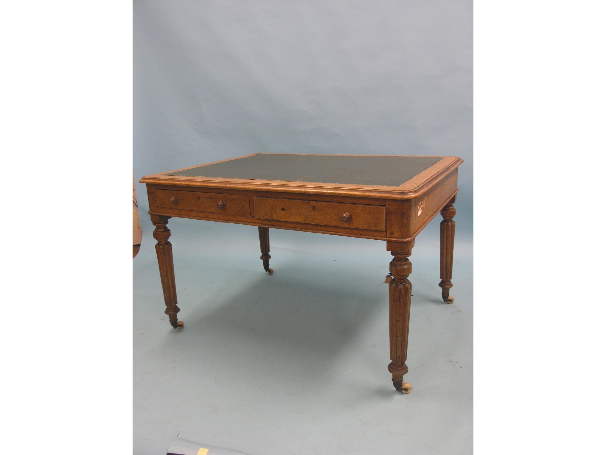 Appraisal: A Victorian oak partner's writing table rectangular-shape with inset leatherette