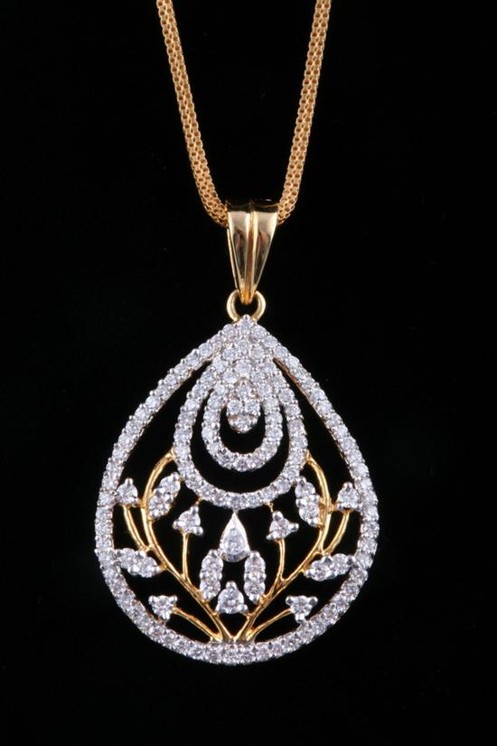 Appraisal: INDIAN K YELLOW GOLD AND DIAMOND FLORAL DESIGN PENDANT ON