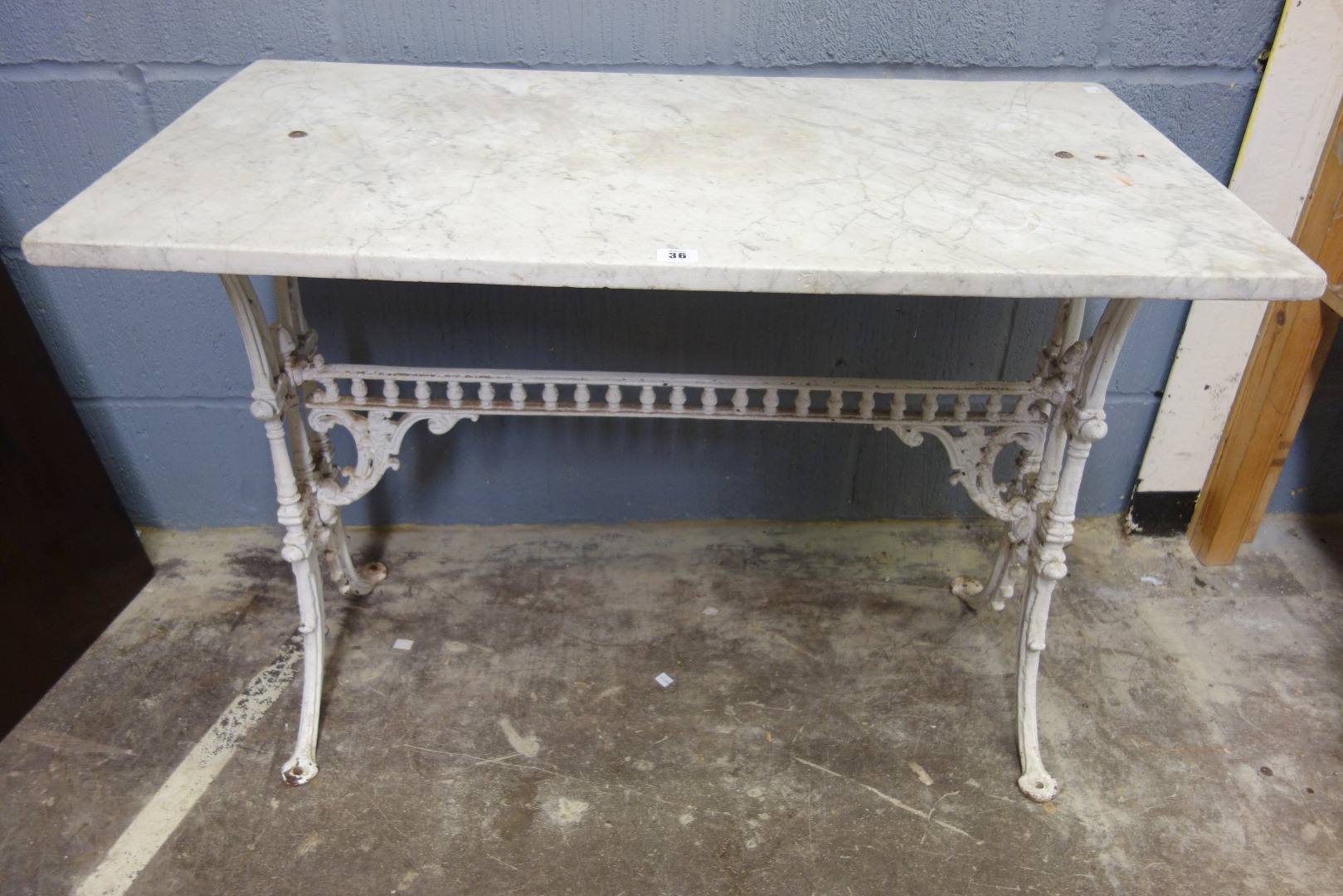 Appraisal: An aesthetic period cast iron loggia table on splayed legs