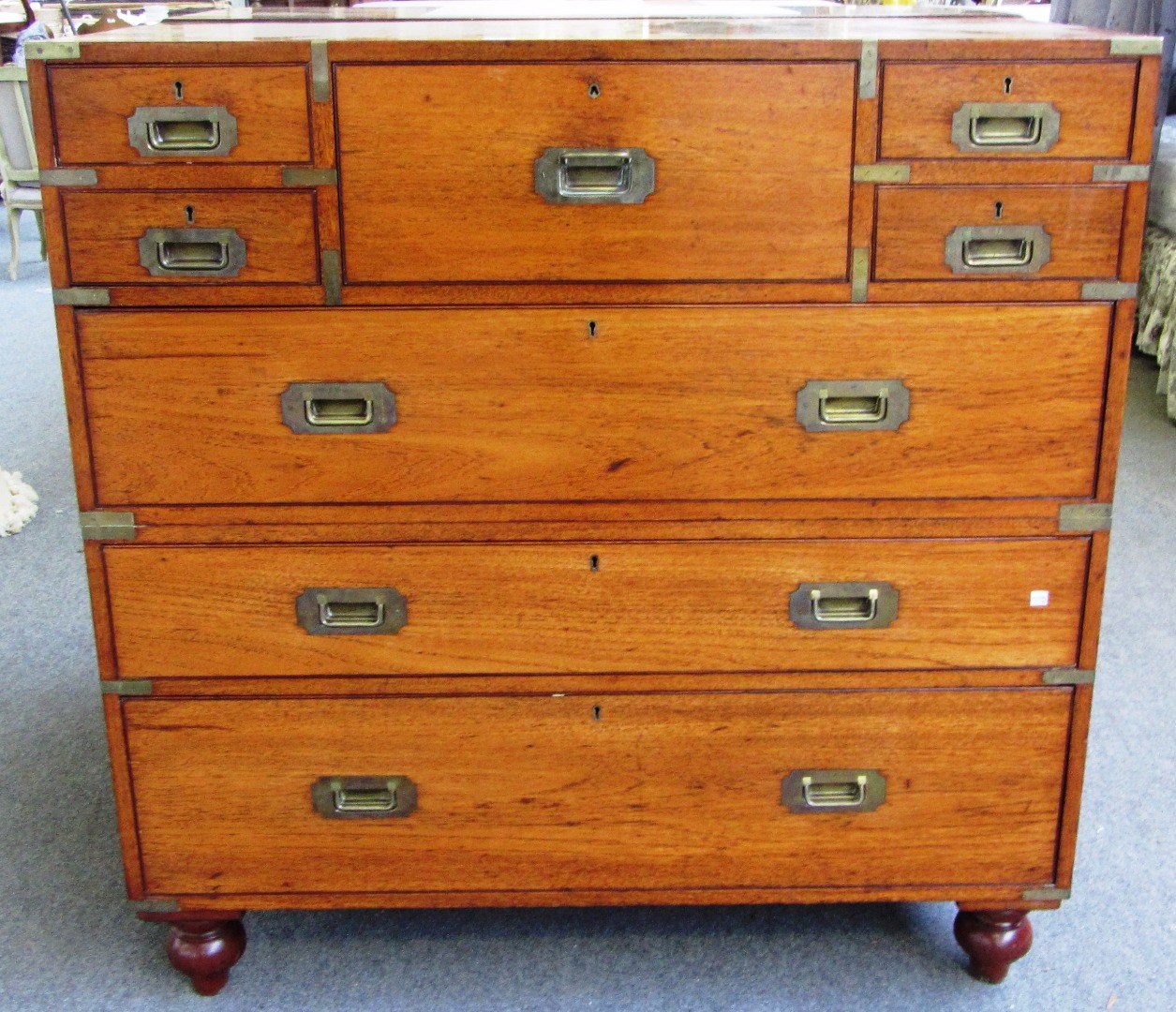 Appraisal: A th century teak two part campaign chest of five