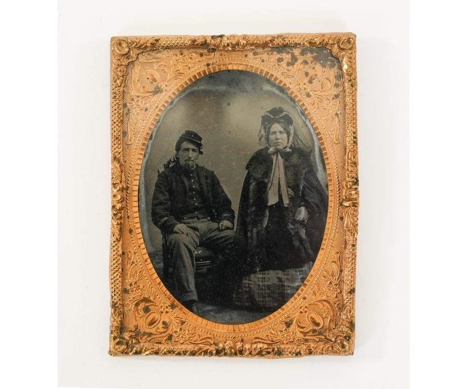 Appraisal: Tintype of a Civil War soldier seated next to presumably