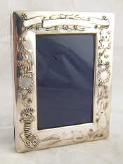 Appraisal: A child's silver photo frame x cm Sheffield millennium mark