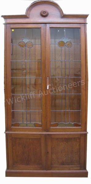 Appraisal: An antique oak bookcase glass doors with stained leaded glass