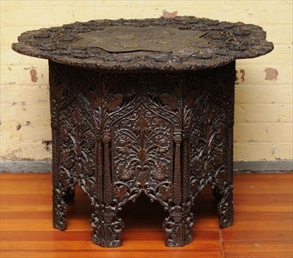 Appraisal: MOORISH CARVED HARDWOOD OCCASIONAL TABLE The round lobed top carved