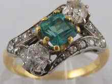 Appraisal: A yellow metal tests carat gold emerald and diamond ring