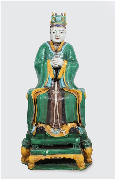 Appraisal: Large Chinese sitting ceramic figure in green robes with folded